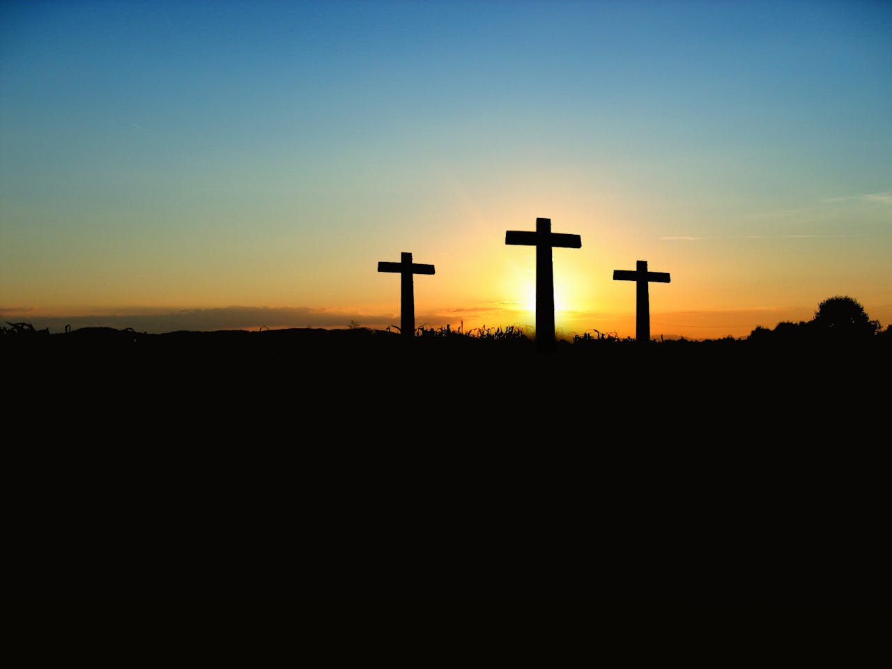 Silhouette Photo of 3 Cross Under the Blue Sky